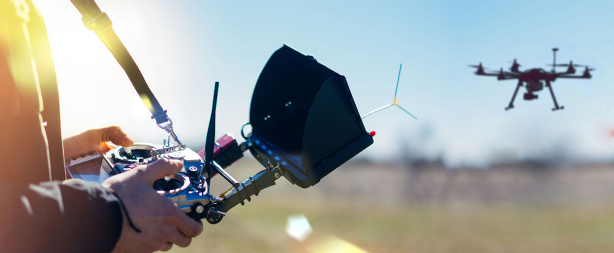 Drone operator working with drone.